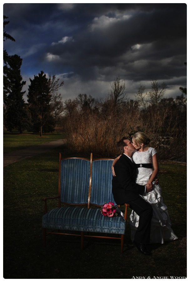 bride and groom kissing in denver park