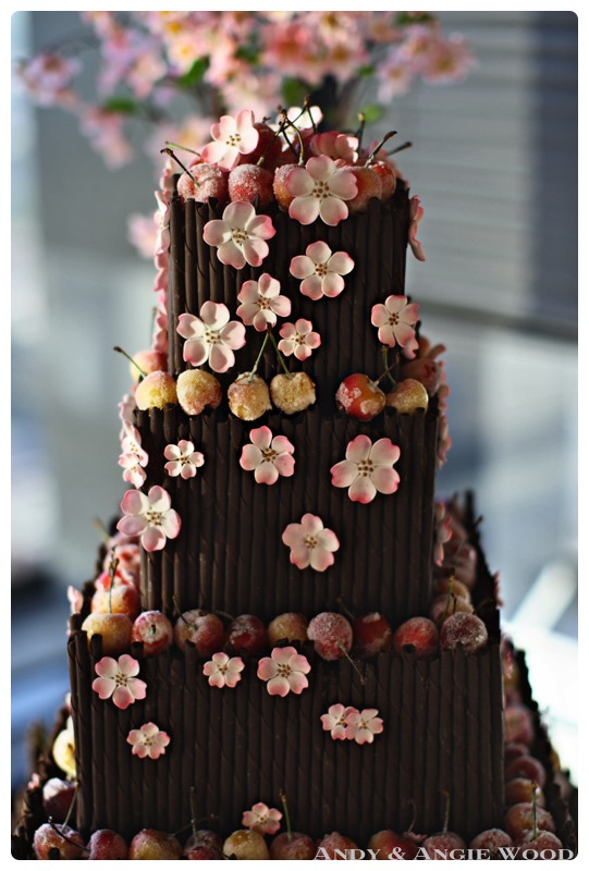 wedding cake with cherries and flowers