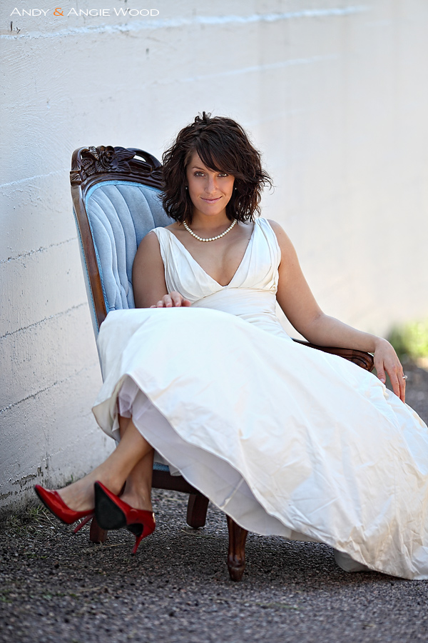 bride having fun with red shoes and blue chair